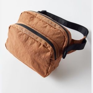 Baggu fanny pack in brown. Black strap with clip.
